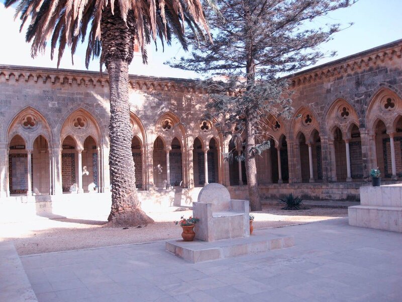 Courtyard with palm tree and arches