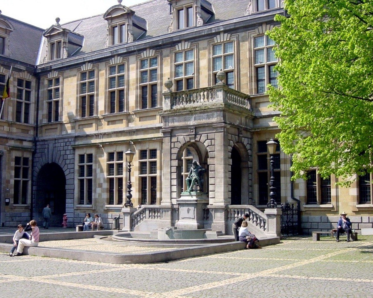 Courtyard with statue and historic building