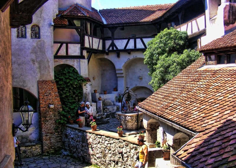 Courtyard with stone fountain and visitors