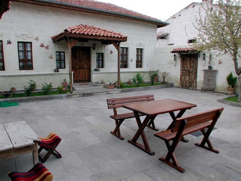 Courtyard with wooden table and benches
