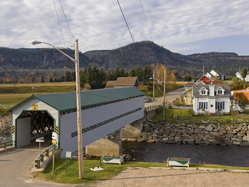 covered bridge in a rural village