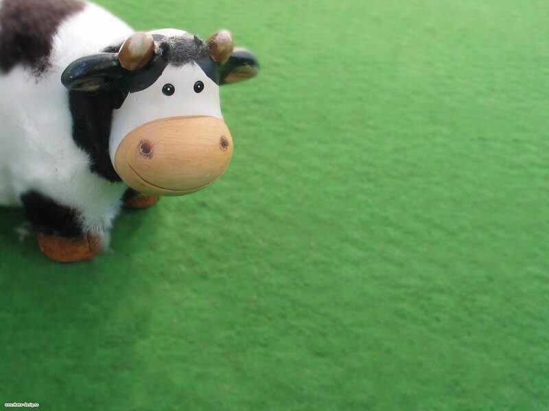 Cow Figurine on Grass
