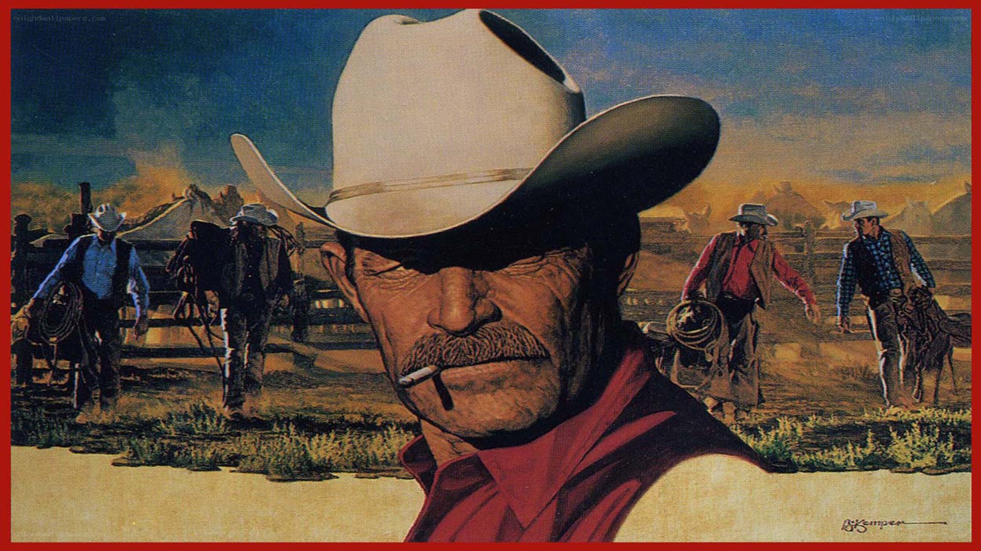 Cowboy at sunset with cattle