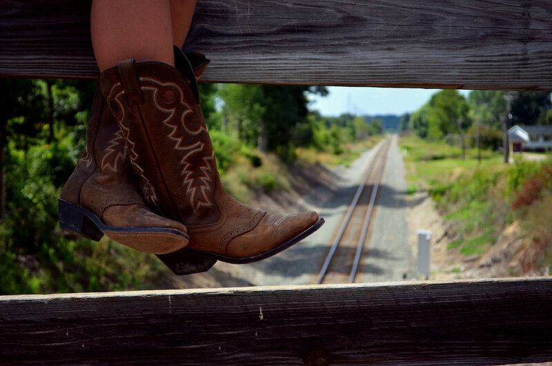 Cowboy Boots on Rail