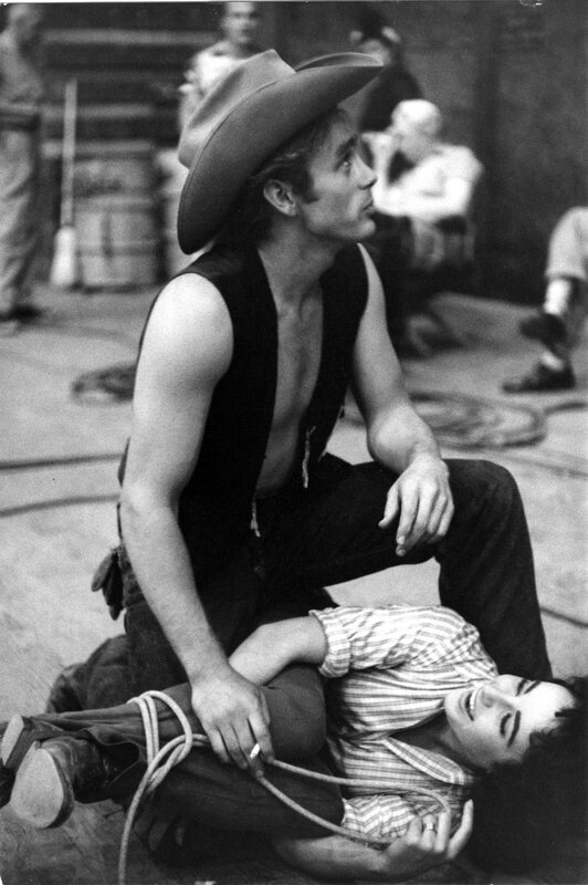 Cowboy holding a woman on the ground