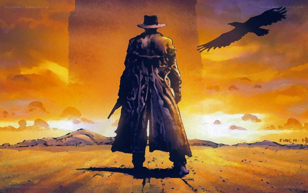 Cowboy in desert at sunset