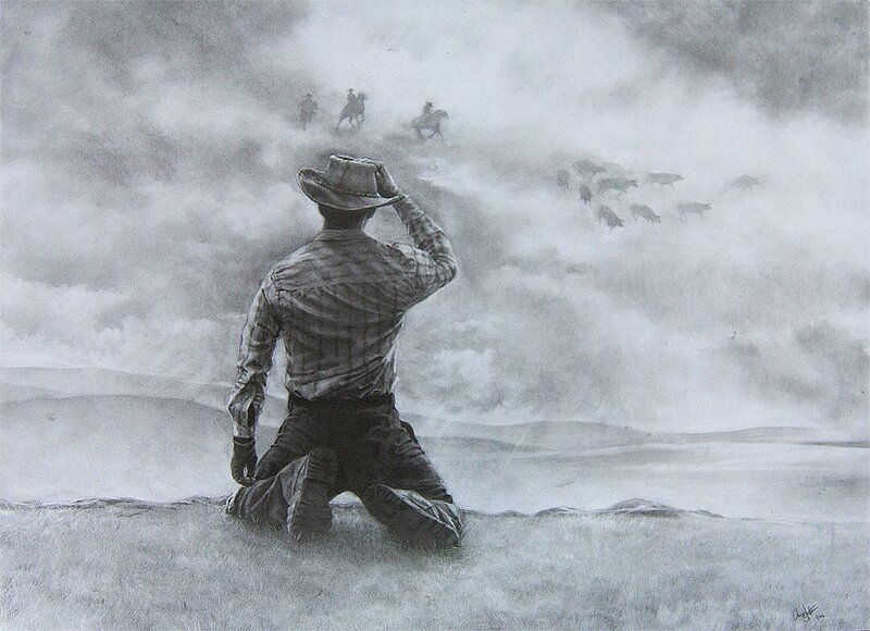 Cowboy Kneeling on Hill