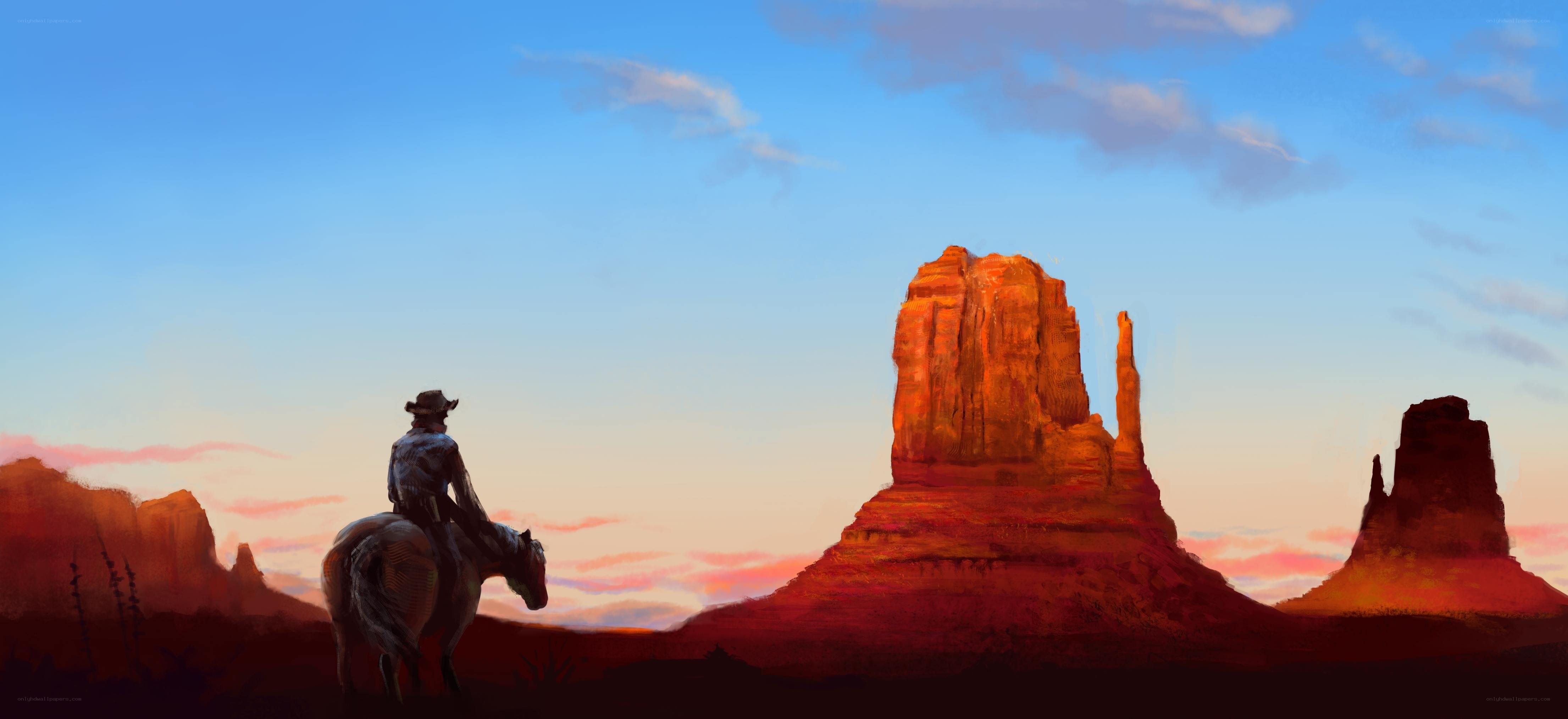 cowboy on horse at sunset