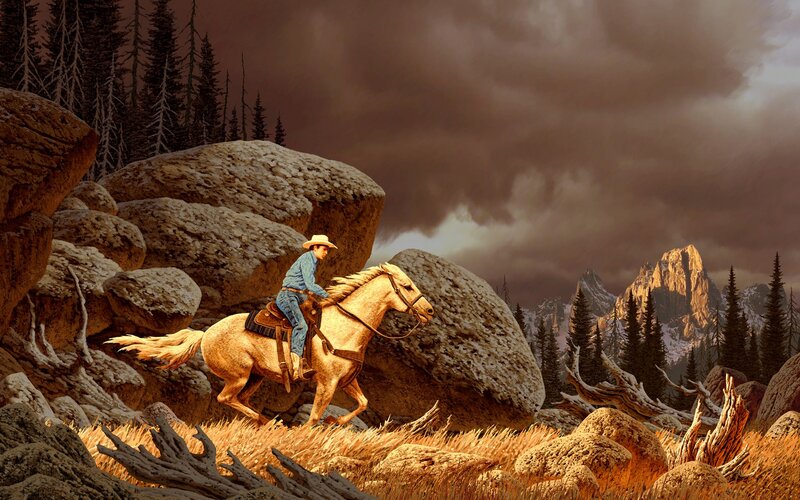 Cowboy on horse in mountain pass