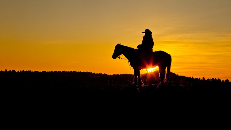 Cowboy on Horse — Orange, Serene, Sunset