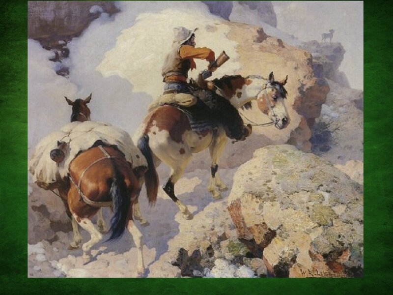 Cowboy on horseback in mountains