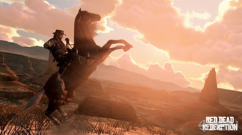 Cowboy on rearing horse at sunset