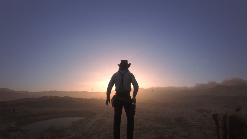 Cowboy Silhouetted at Sunset