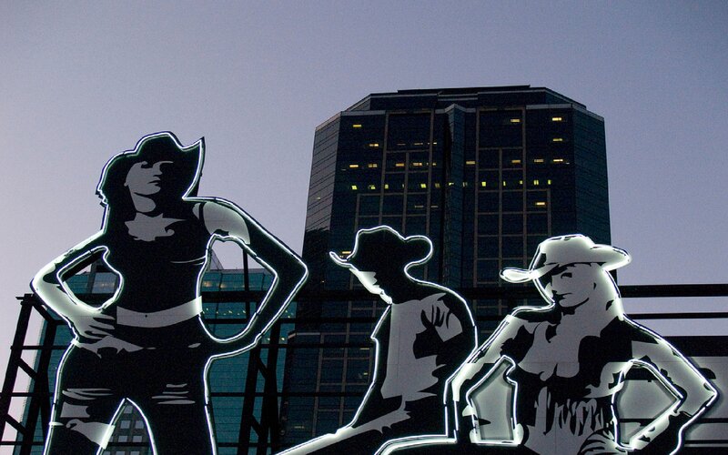 Cowboy Statues at Dusk
