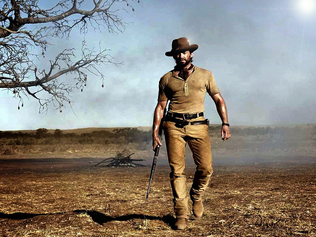 cowboy walking in desert