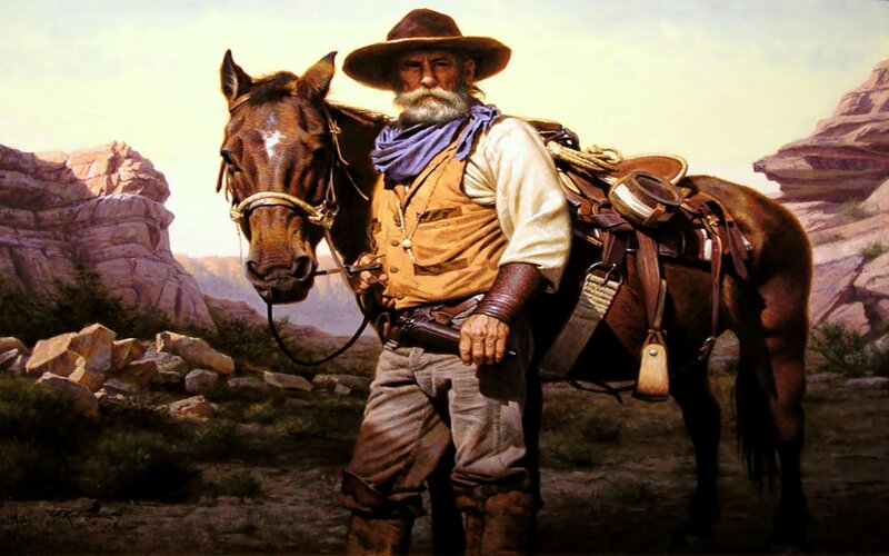Cowboy with horse in desert