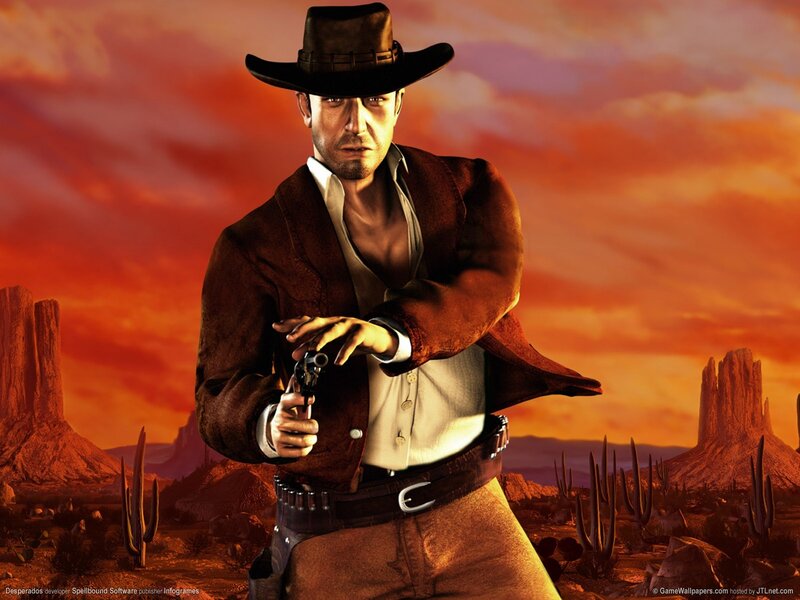Cowboy with revolver in desert