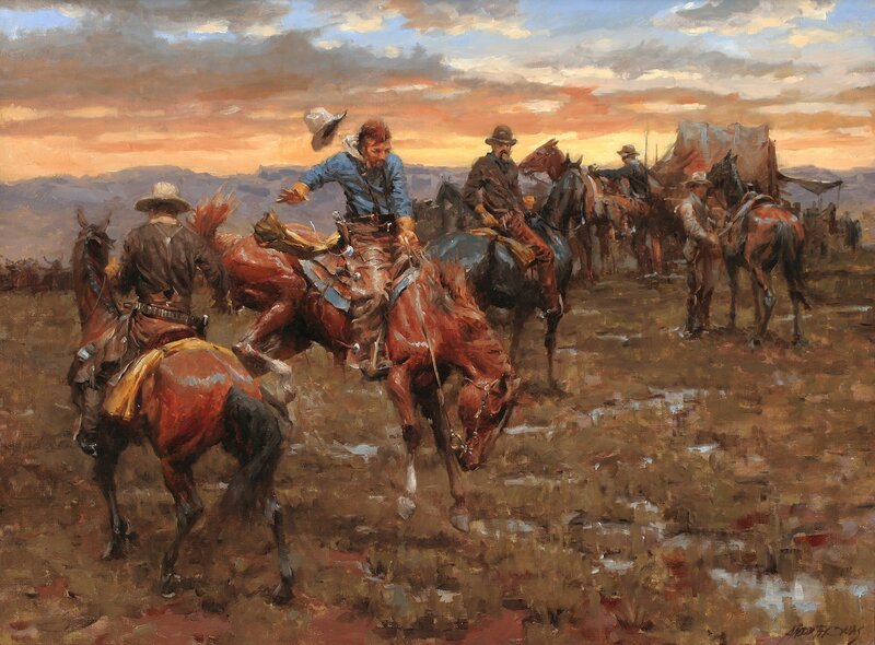 Cowboys on horseback at sunset