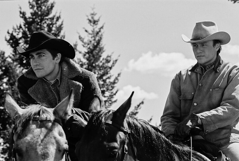 Cowboys on horseback in black and white