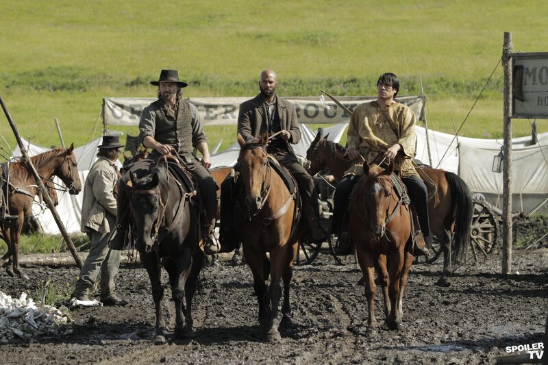 cowboys on horseback in mud