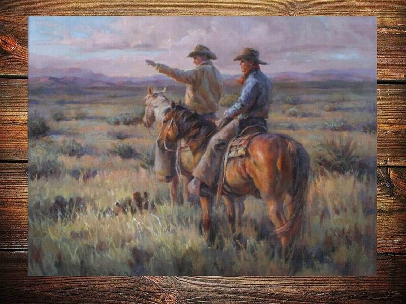 Cowboys on horseback in the desert