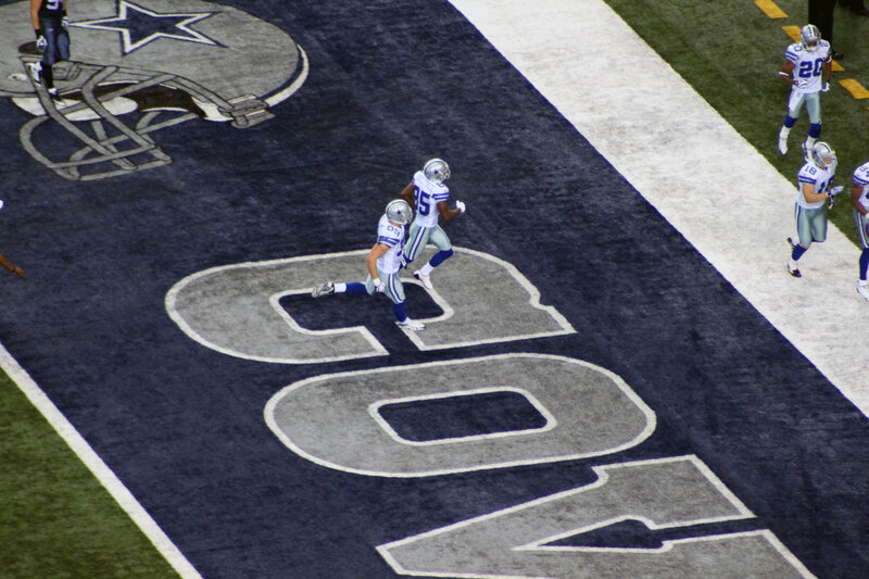 Cowboys players on field