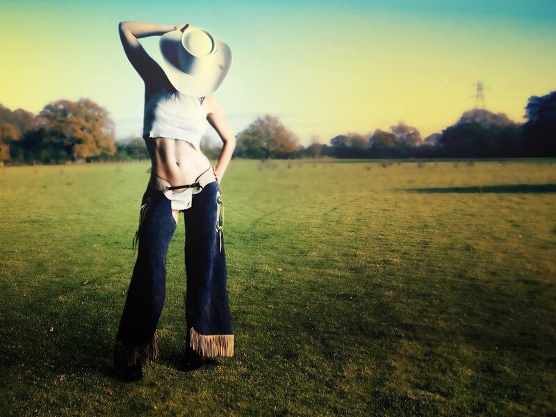 Cowgirl in a field