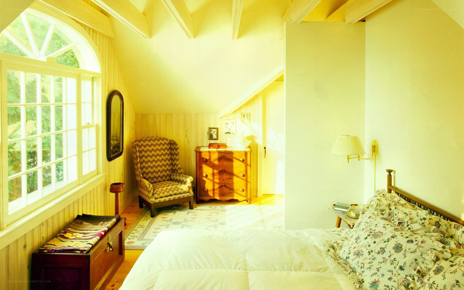 Cozy attic bedroom with arched window