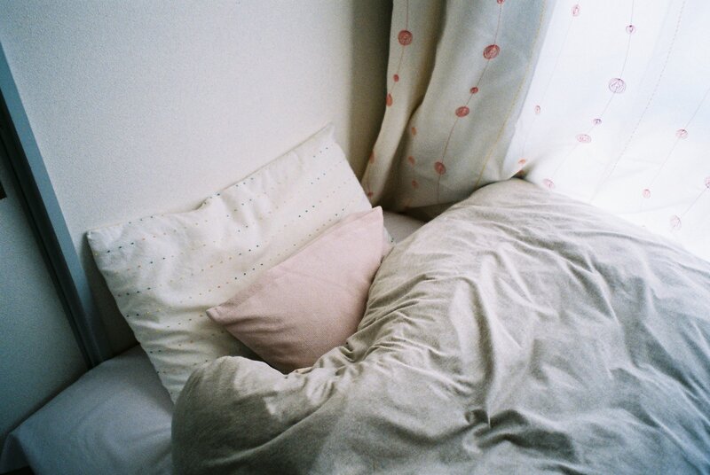 cozy bed corner with pillows