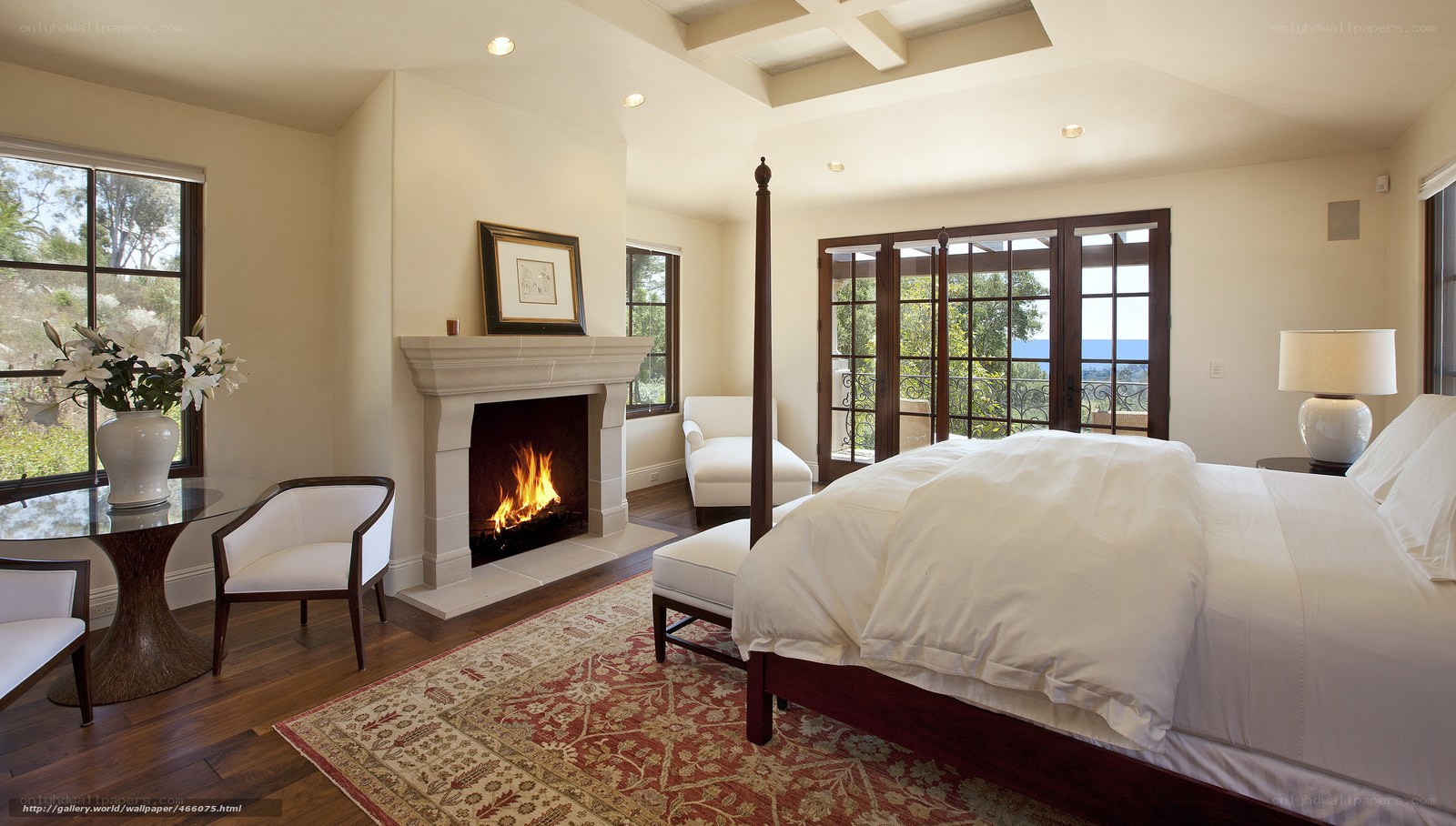 Cozy bedroom with fireplace and ocean view