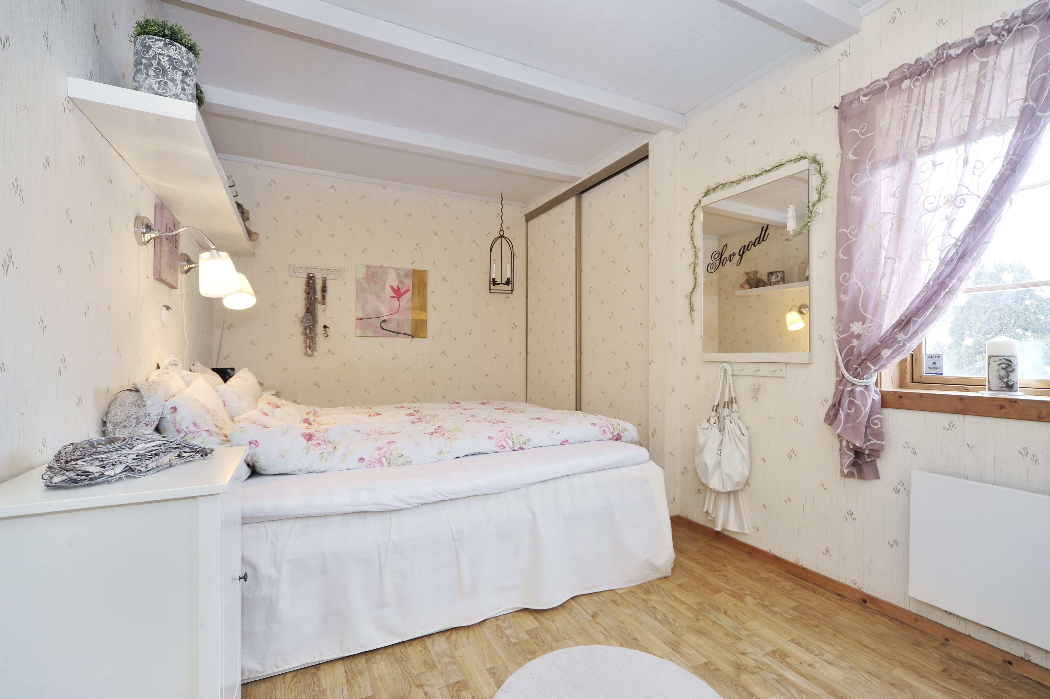 cozy bedroom with floral bedding