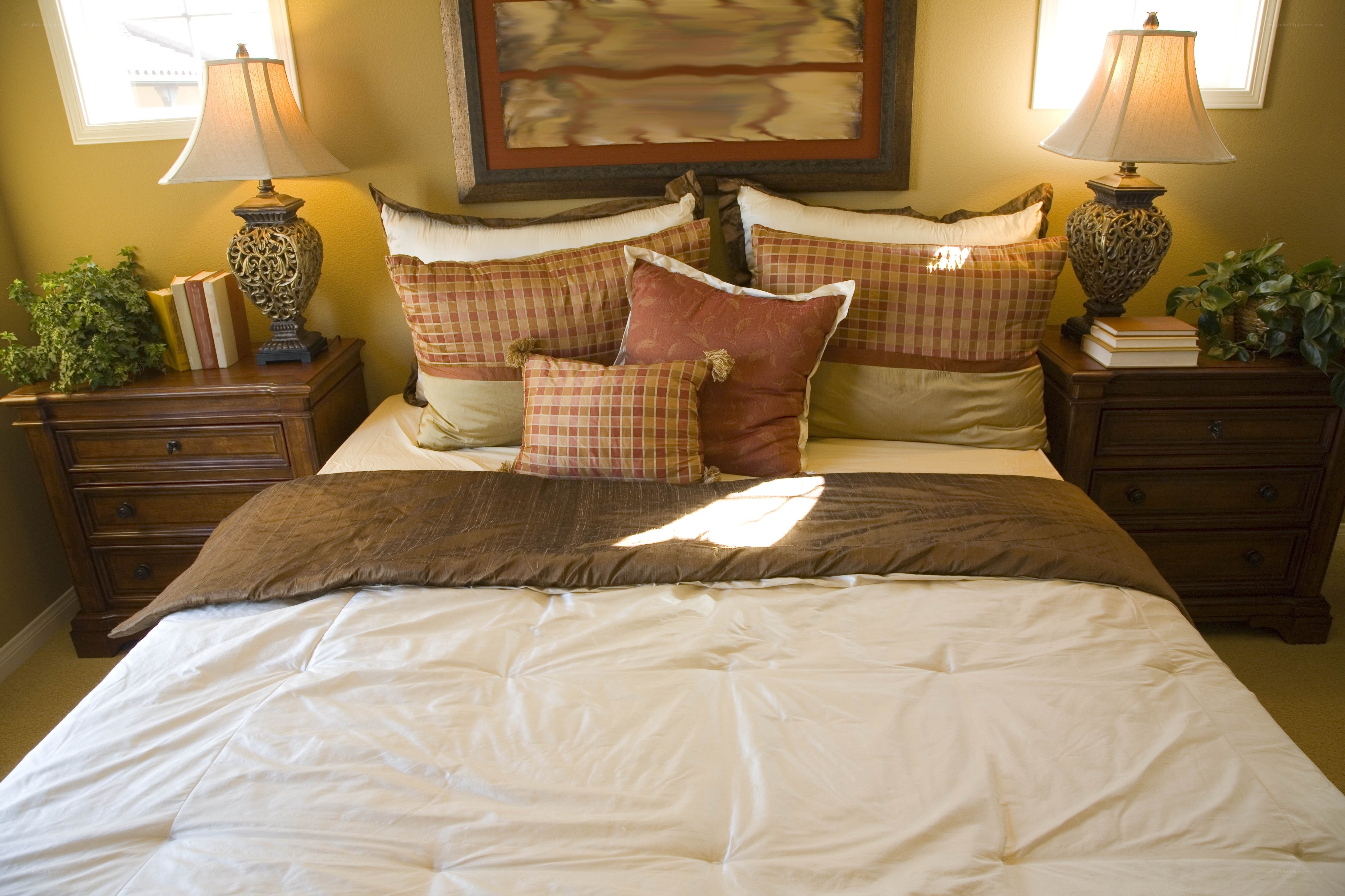 cozy bedroom with plaid pillows