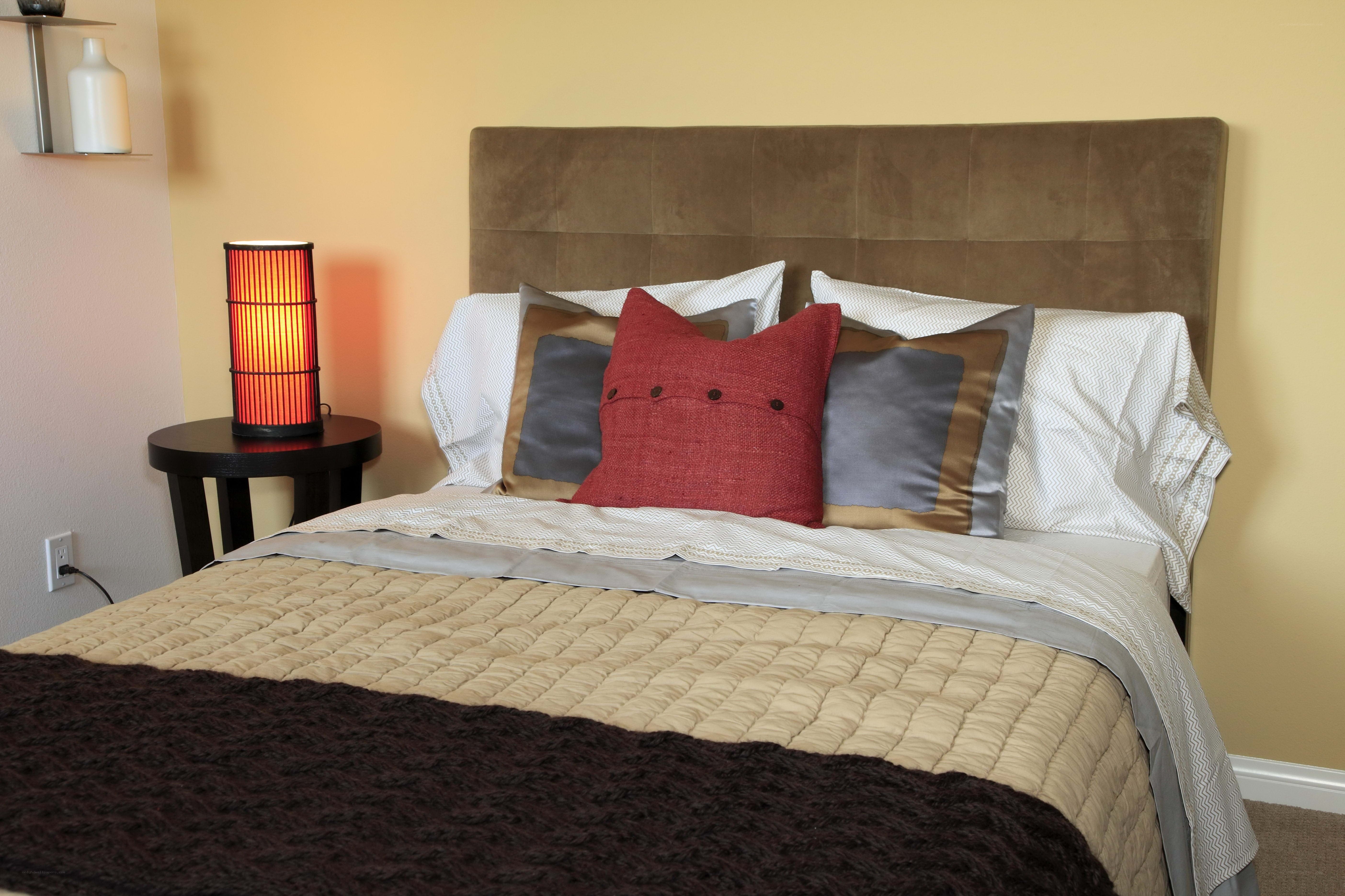 cozy bedroom with red lamp