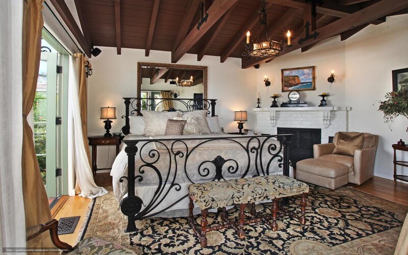 cozy bedroom with wrought iron bed