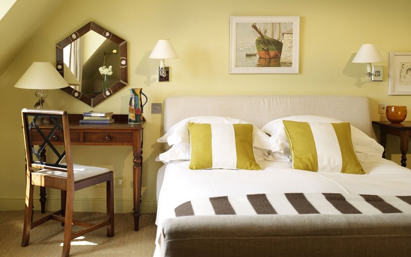 Cozy bedroom with yellow walls