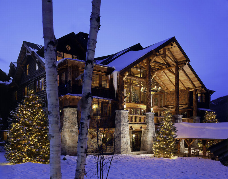 Cozy cabin at dusk with Christmas lights
