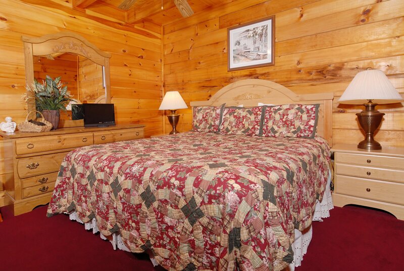 cozy cabin bedroom with wooden walls