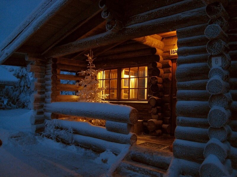 Cozy cabin in snowy evening