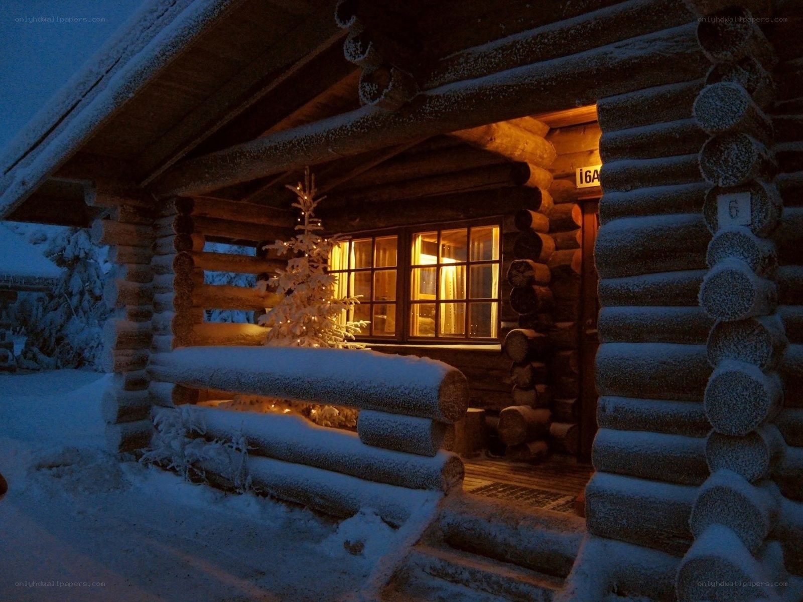 Cozy cabin in snowy evening