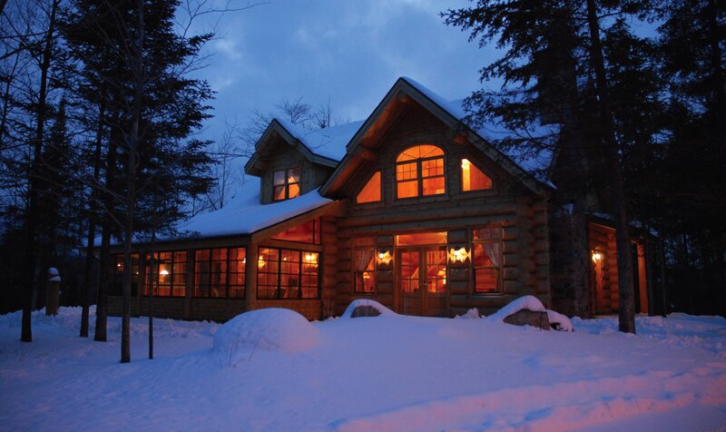 Cozy cabin in snowy forest