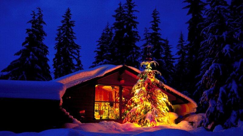Cozy cabin in snowy night