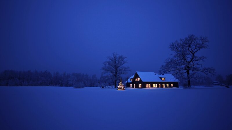Cozy cabin in snowy night
