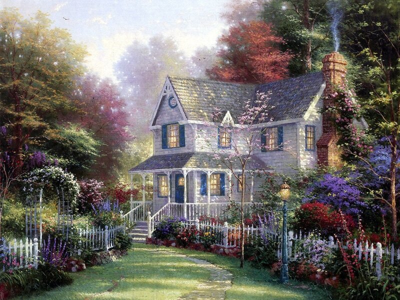 Cozy cottage in a flower garden