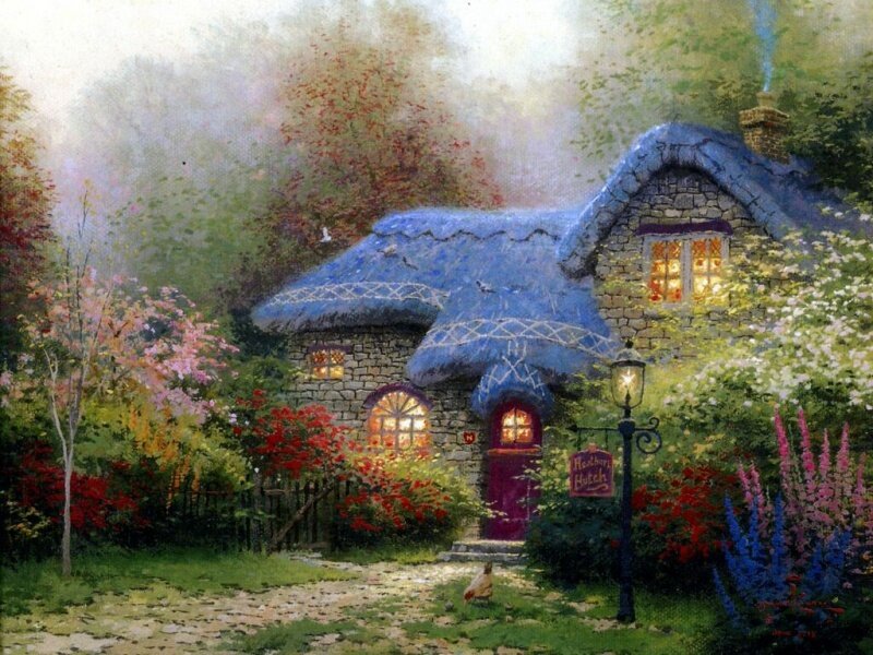 Cozy cottage in a flower garden