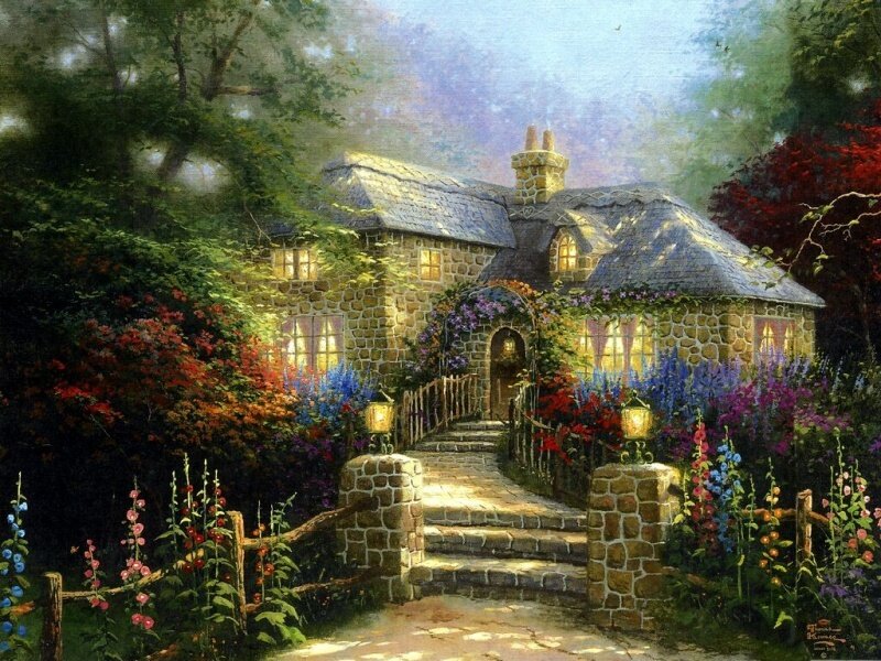 Cozy cottage in a flower garden