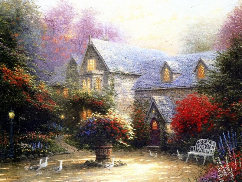 Cozy cottage in a flower garden