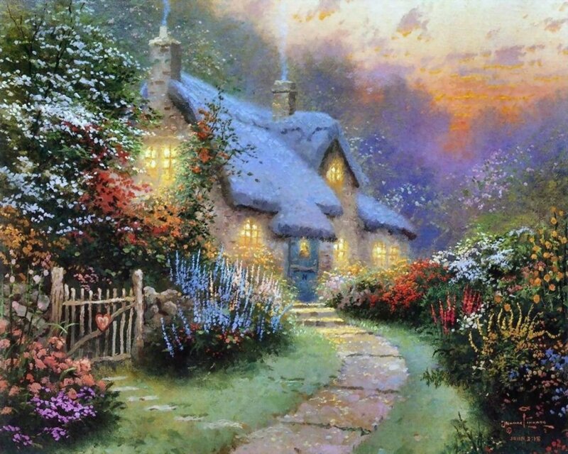 Cozy cottage in a flower garden