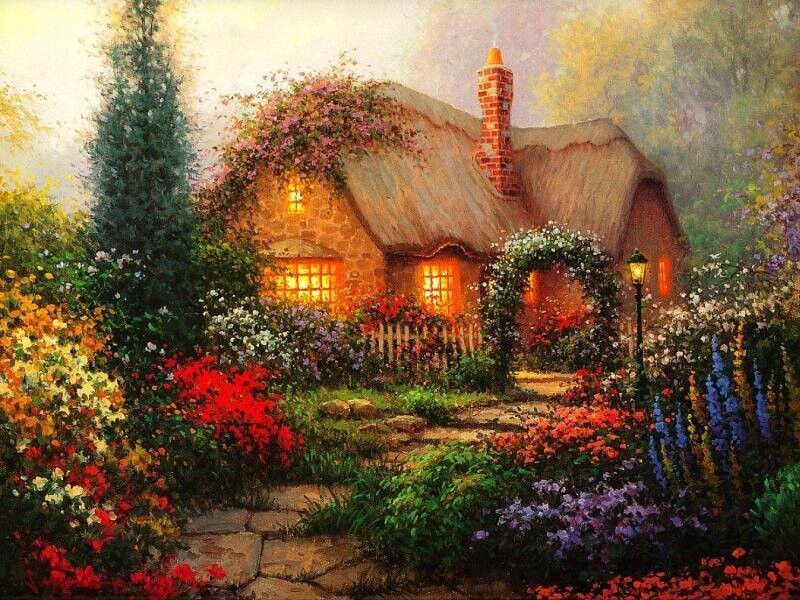 Cozy cottage in a flower garden