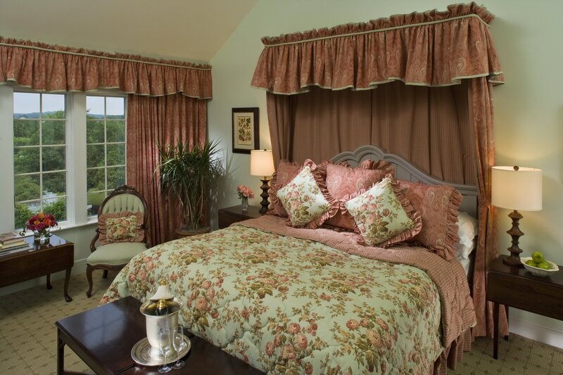 Cozy floral bedroom with canopy bed