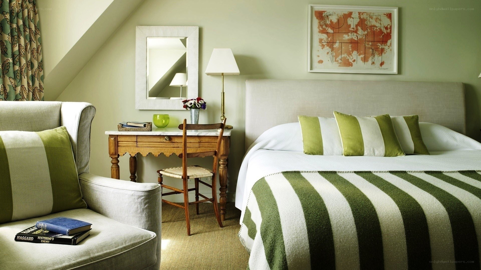 Cozy green bedroom with striped bedding